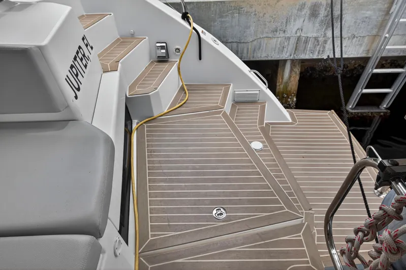 Sundecker Yacht Photos Pics Leopard 45 yacht deck with teak flooring, docked in Jupiter, FL, 2021 model.