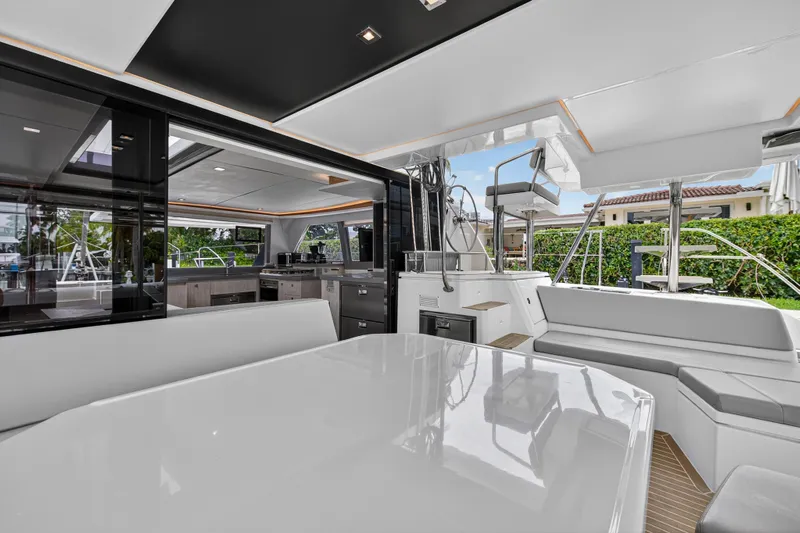 Sundecker Yacht Photos Pics Luxurious 2021 Leopard 45 yacht interior with modern seating and sleek design.