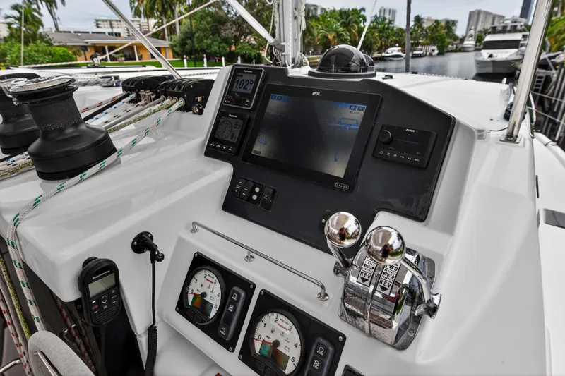 Sundecker Yacht Photos Pics Control panel of a 2021 Leopard 45 yacht with navigation instruments and throttle levers.