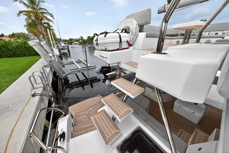 Sundecker Yacht Photos Pics Leopard 45 catamaran, 2021 model, docked with modern deck and seating area.