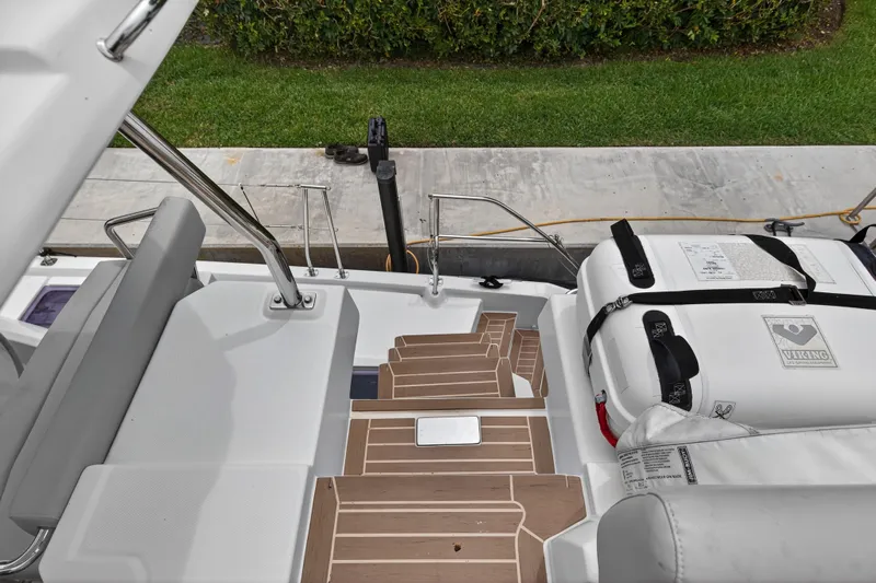 Sundecker Yacht Photos Pics Sleek Leopard 45 yacht deck with wooden steps and safety equipment, 2021 model.