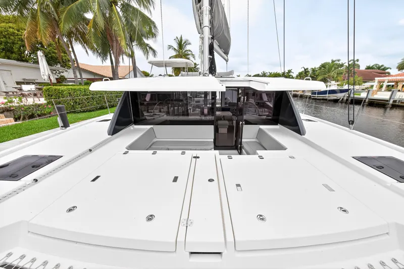 Sundecker Yacht Photos Pics 2021 Leopard 45 catamaran docked, featuring spacious deck and modern design.