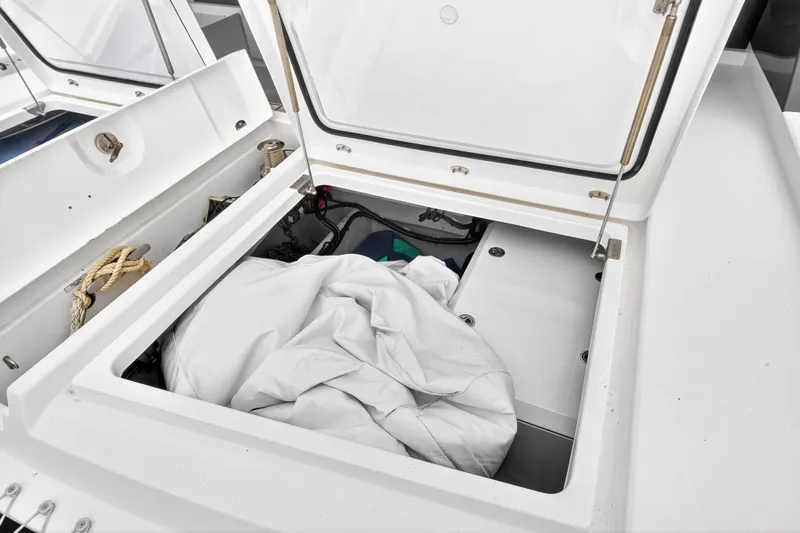 Sundecker Yacht Photos Pics Open storage compartment on 2021 Leopard 45 yacht, containing ropes and equipment.