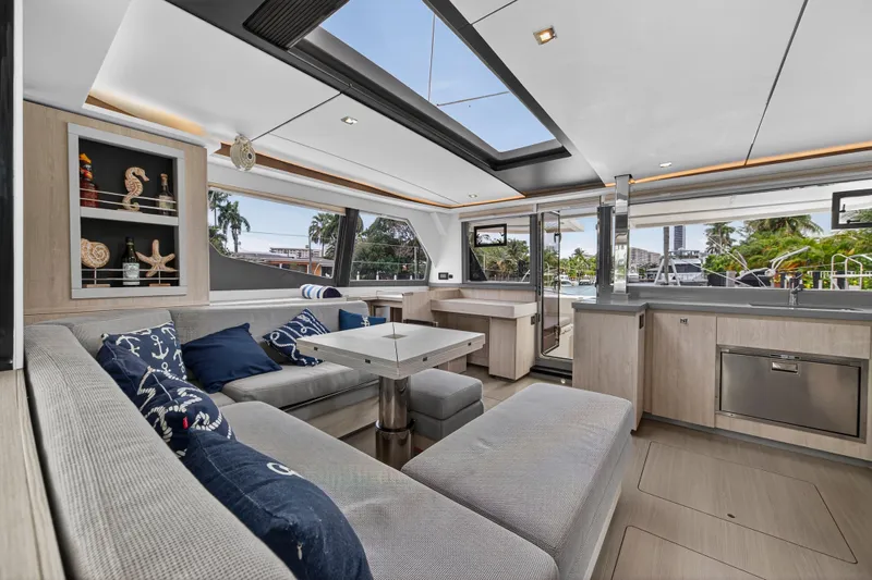 Sundecker Yacht Photos Pics Luxurious interior of 2021 Leopard 45 yacht with modern furnishings and large windows.