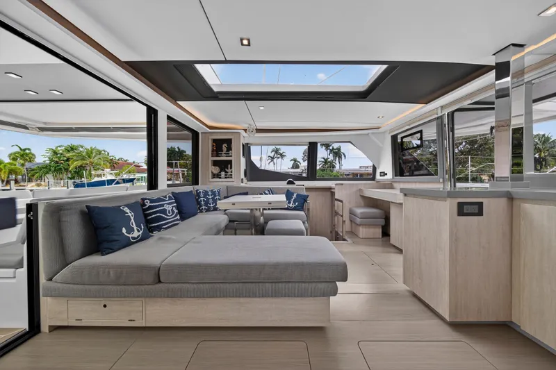 Sundecker Yacht Photos Pics Luxurious interior of 2021 Leopard 45 catamaran with modern design and spacious seating area.
