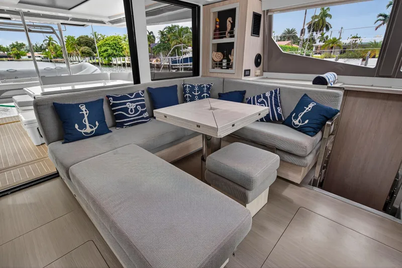 Sundecker Yacht Photos Pics Luxurious interior of 2021 Leopard 45 yacht with nautical-themed decor and modern seating.