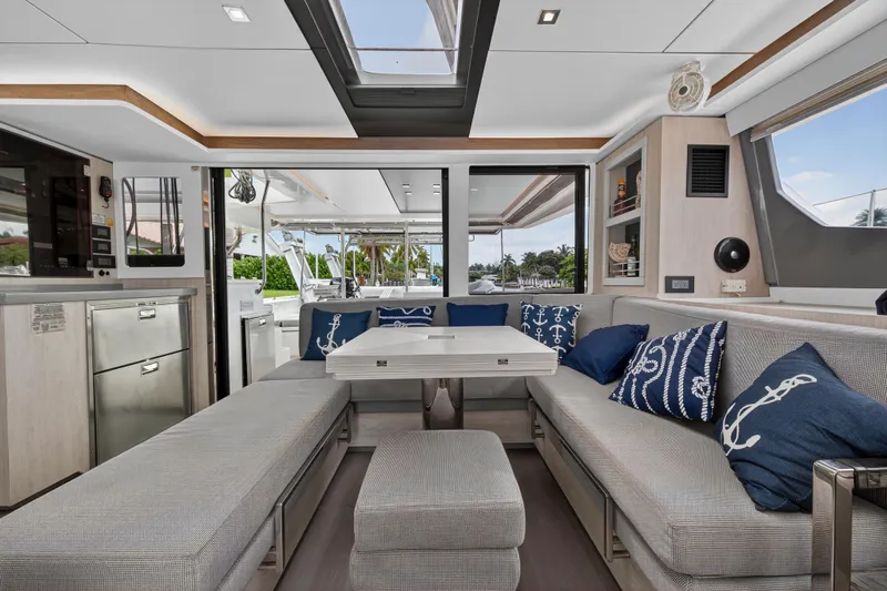 Sundecker Yacht Photos Pics Luxurious interior of 2021 Leopard 45 yacht with modern seating and nautical decor.