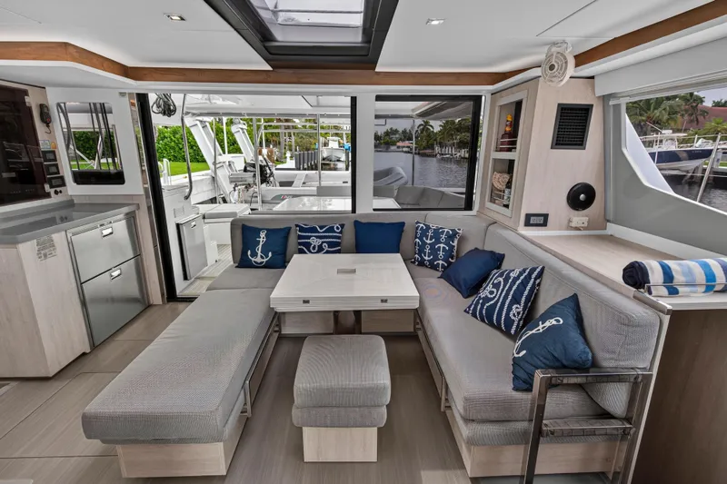 Sundecker Yacht Photos Pics Luxurious interior of 2021 Leopard 45 yacht with elegant seating and nautical decor.