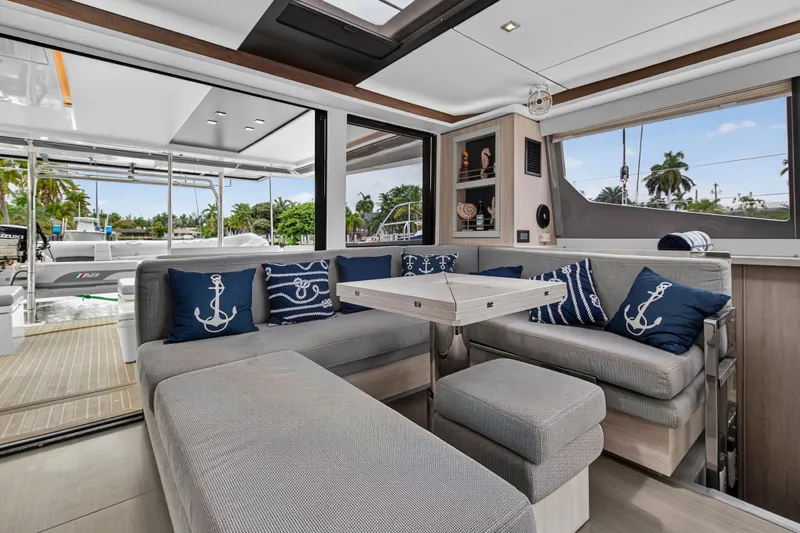 Sundecker Yacht Photos Pics Luxurious interior of 2021 Leopard 45 yacht with nautical-themed decor and spacious seating.