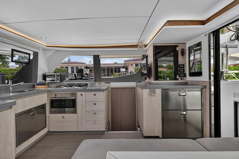 Sundecker Yacht Photos Pics Modern kitchen interior of 2021 Leopard 45 yacht with sleek appliances and stylish design.