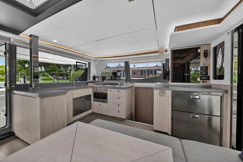 Sundecker Yacht Photos Pics Modern kitchen interior of 2021 Leopard 45 yacht with sleek design and appliances.