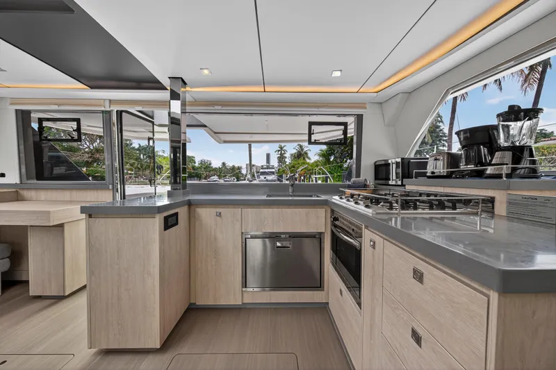 Sundecker Yacht Photos Pics Modern kitchen interior on a 2021 Leopard 45 yacht, featuring sleek appliances and ample counter space.