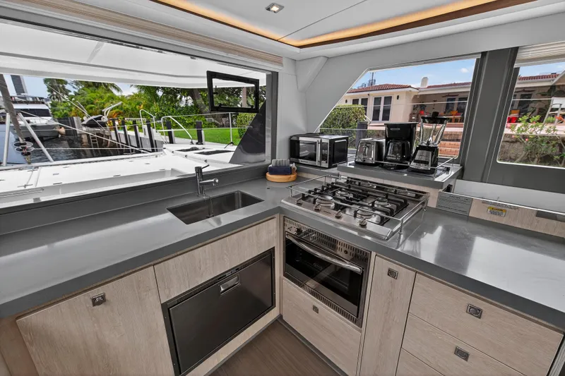 Sundecker Yacht Photos Pics Modern kitchen in 2021 Leopard 45 yacht with appliances and sleek countertops.