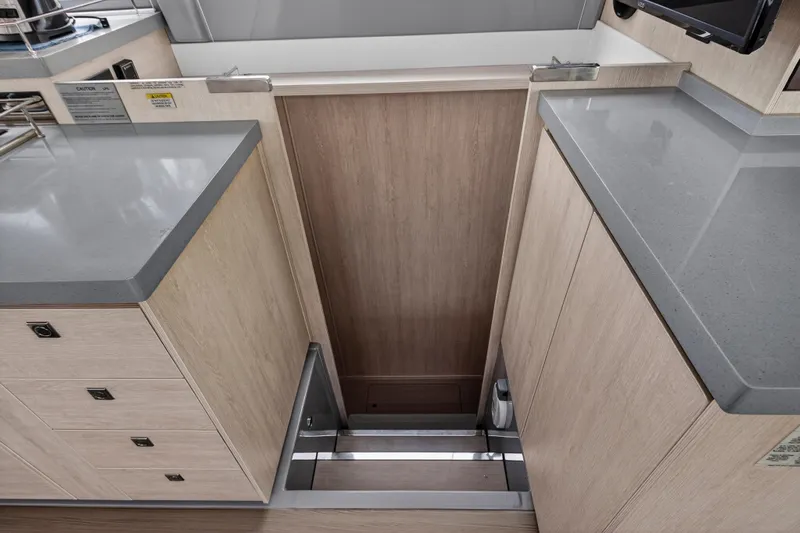 Sundecker Yacht Photos Pics Modern kitchen area in a 2021 Leopard 45 yacht with sleek countertops.