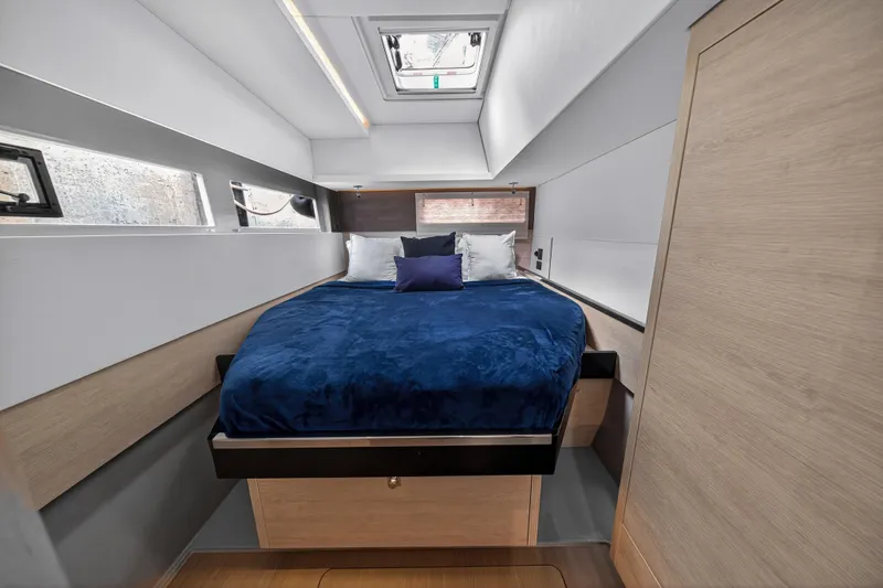 Sundecker Yacht Photos Pics Luxurious cabin interior of 2021 Leopard 45 yacht with cozy bed and modern design.