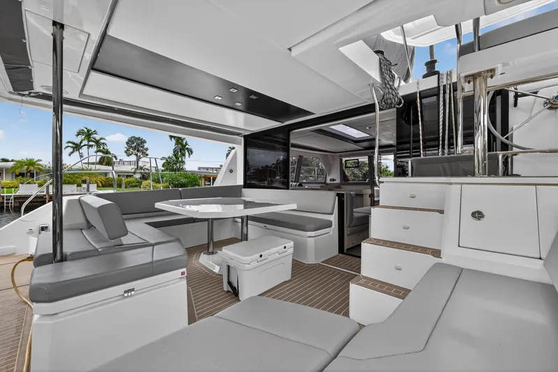 Sundecker Yacht Photos Pics Luxurious 2021 Leopard 45 yacht interior with modern seating and dining area.
