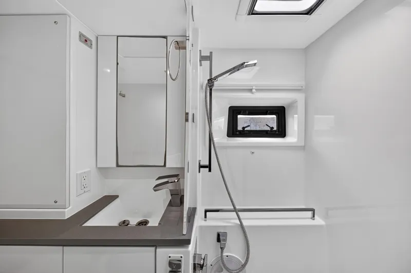 Sundecker Yacht Photos Pics Modern bathroom in 2021 Leopard 45 yacht with sleek fixtures and compact design.