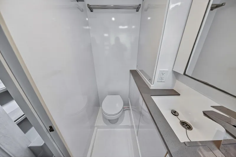 Sundecker Yacht Photos Pics Modern bathroom in 2021 Leopard 45 yacht, featuring sleek design and compact layout.