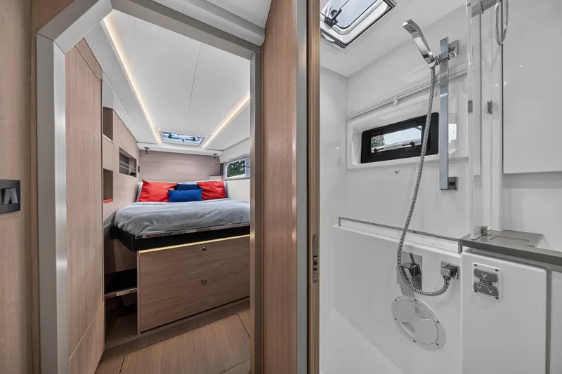 Sundecker Yacht Photos Pics Luxurious interior of 2021 Leopard 45 yacht featuring bedroom and modern bathroom.