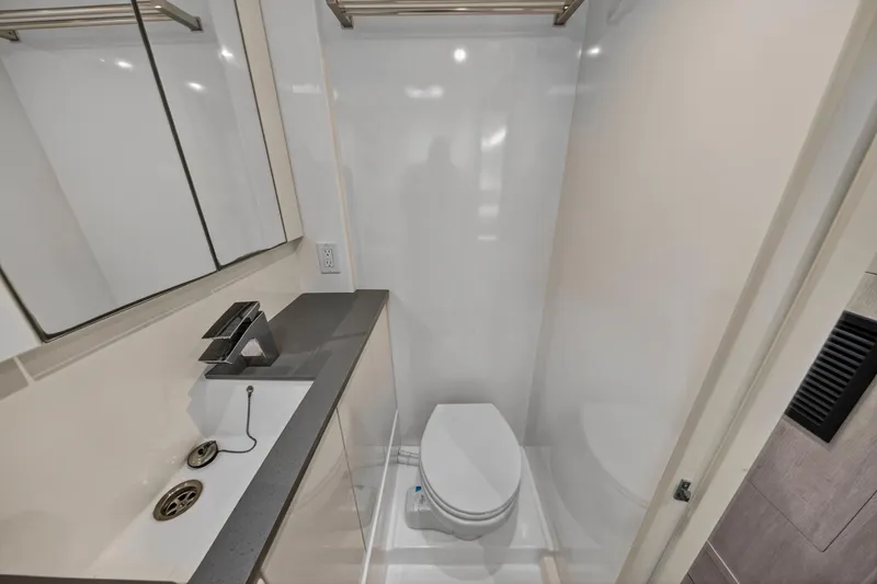 Sundecker Yacht Photos Pics Modern bathroom in 2021 Leopard 45 yacht with sleek fixtures and compact design.