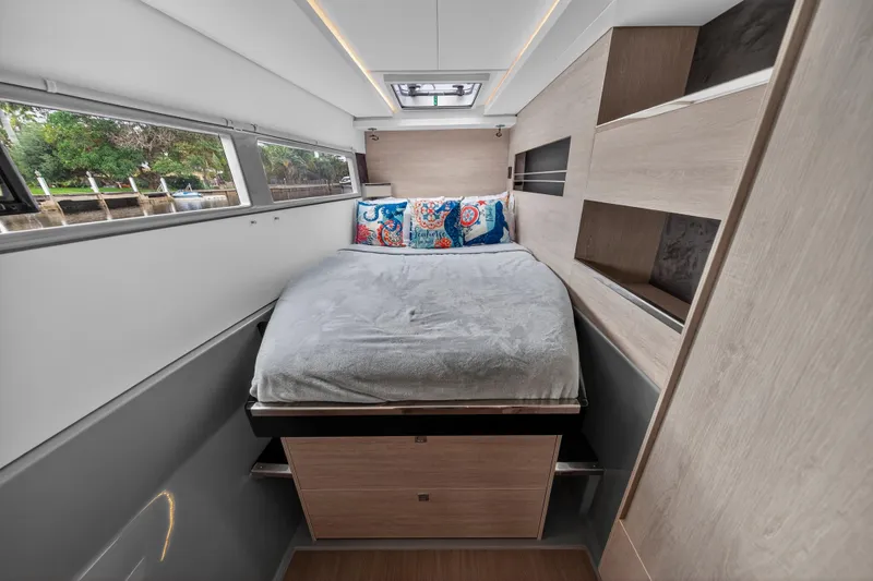 Sundecker Yacht Photos Pics Luxurious bedroom interior of 2021 Leopard 45 yacht with modern design and cozy bedding.