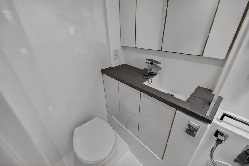 Sundecker Yacht Photos Pics Modern bathroom in 2021 Leopard 45 yacht with sleek fixtures and minimalist design.