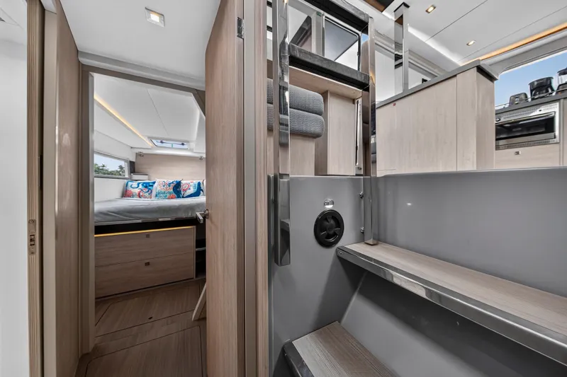 Sundecker Yacht Photos Pics Interior of 2021 Leopard 45 yacht featuring modern bedroom and sleek kitchen design.