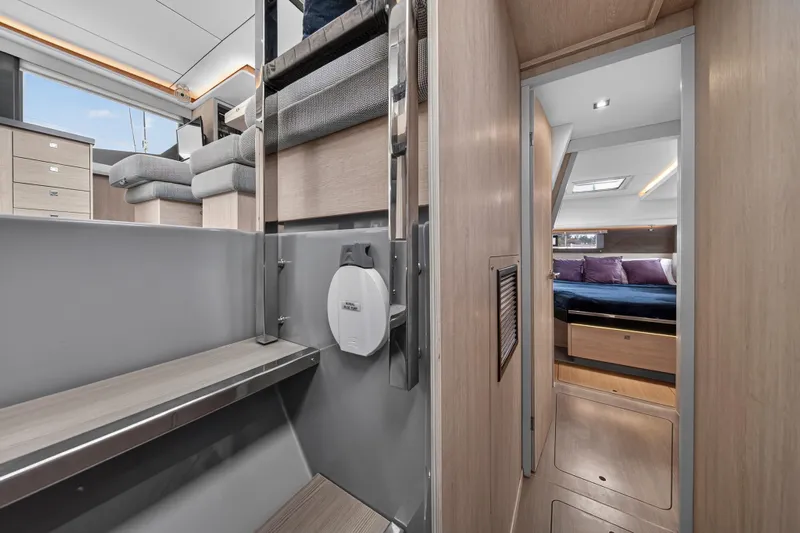 Sundecker Yacht Photos Pics Modern interior of 2021 Leopard 45 yacht with cozy bedroom and sleek design.