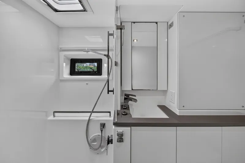 Sundecker Yacht Photos Pics Modern bathroom interior of 2021 Leopard 45 yacht, featuring sleek design and fixtures.