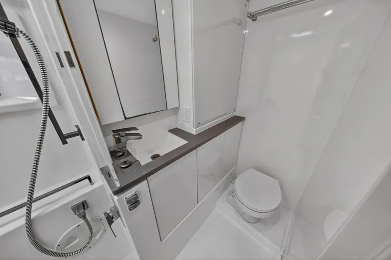 Sundecker Yacht Photos Pics Modern bathroom in 2021 Leopard 45 yacht, featuring sleek fixtures and compact design.