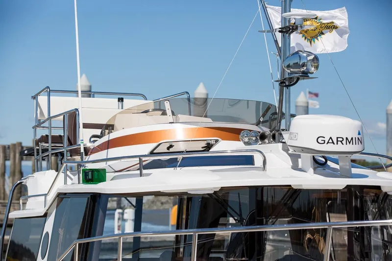  Yacht Photos Pics 2026 Ranger Tugs R-29 CB boat with Garmin equipment, docked under clear blue sky.