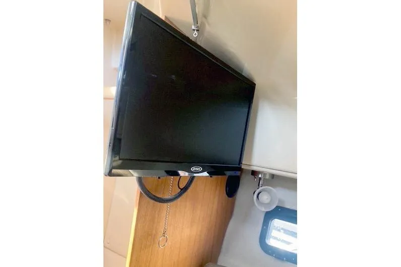  Yacht Photos Pics Interior of 2021 Ranger Tugs R-25 with mounted TV and window.