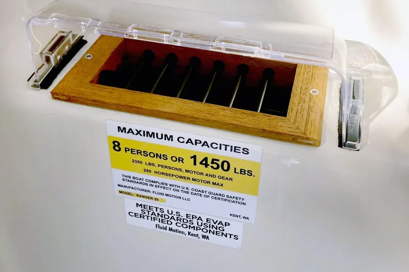  Yacht Photos Pics Ranger Tugs R-25 2021 capacity label, 8 persons or 1450 lbs, safety compliance.