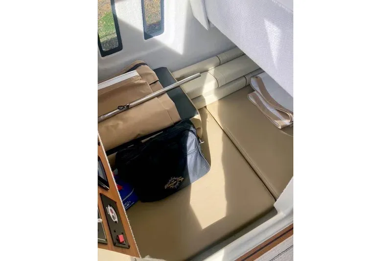  Yacht Photos Pics 2021 Ranger Tugs R-25 interior cabin with storage and seating area.