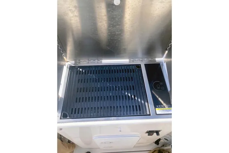  Yacht Photos Pics Outdoor grill on 2021 Ranger Tugs R-25 boat, featuring a sleek stainless steel design.