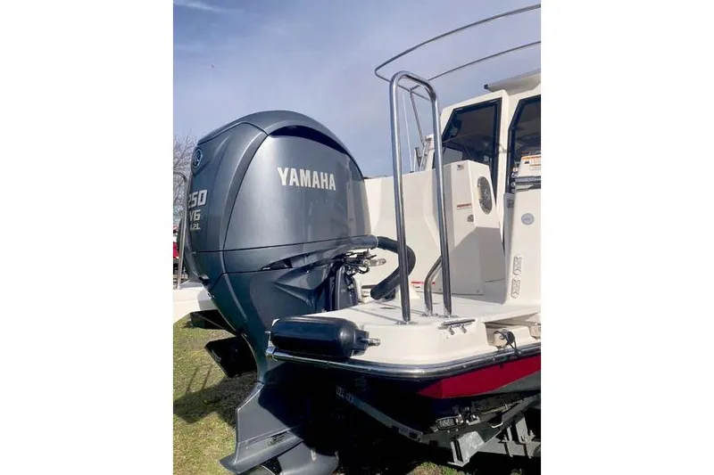  Yacht Photos Pics 2021 Ranger Tugs R-25 with Yamaha V6 outboard motor, docked on grass.
