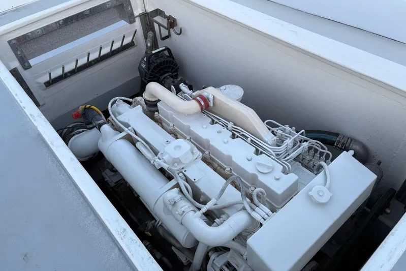  Yacht Photos Pics Engine compartment of a 1994 Custom Workboat, showcasing a well-maintained marine engine.
