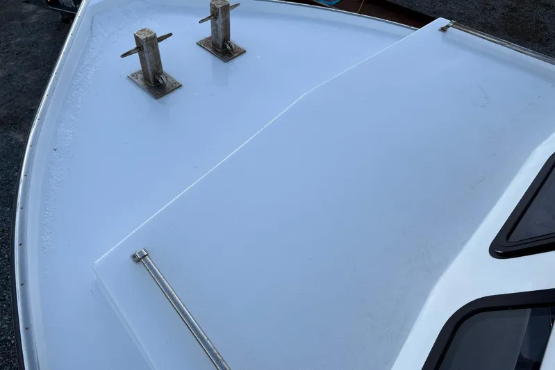  Yacht Photos Pics Bow of a 1994 Custom Workboat with cleats and windows.