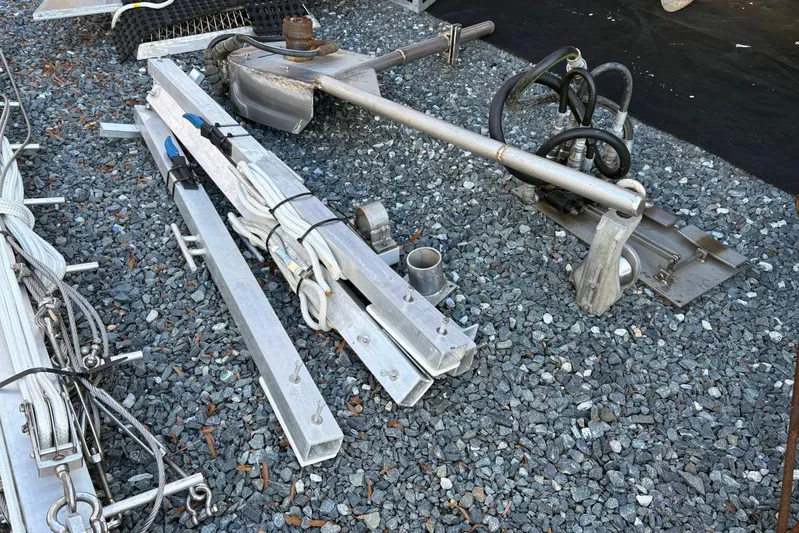  Yacht Photos Pics Metal components and cables on gravel, related to a 1994 Custom Workboat.