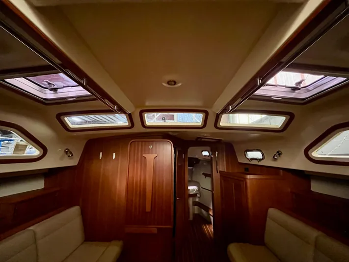 Intrepid II Yacht Photos Pics Interior of 2008 Island Packet 465 yacht, featuring wood paneling and skylights.