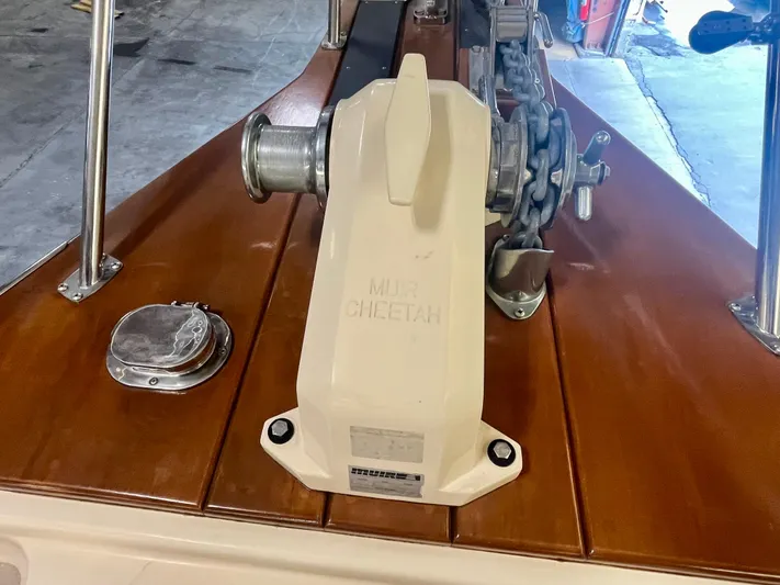 Intrepid II Yacht Photos Pics 2008 Island Packet 465 yacht anchor windlass on polished wooden deck.