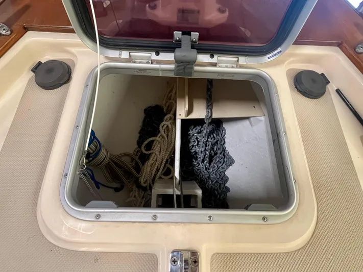 Intrepid II Yacht Photos Pics Anchor locker of 2008 Island Packet 465 sailboat with ropes and chains.
