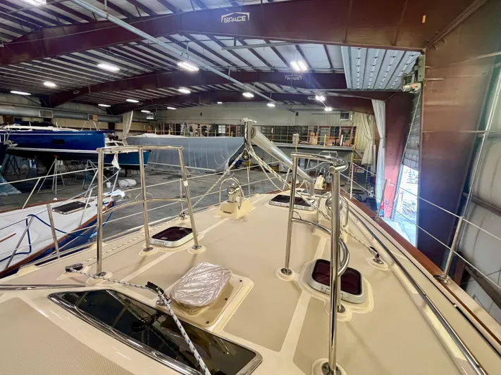 Intrepid II Yacht Photos Pics 2008 Island Packet 465 sailboat in indoor storage, showcasing deck and rigging.