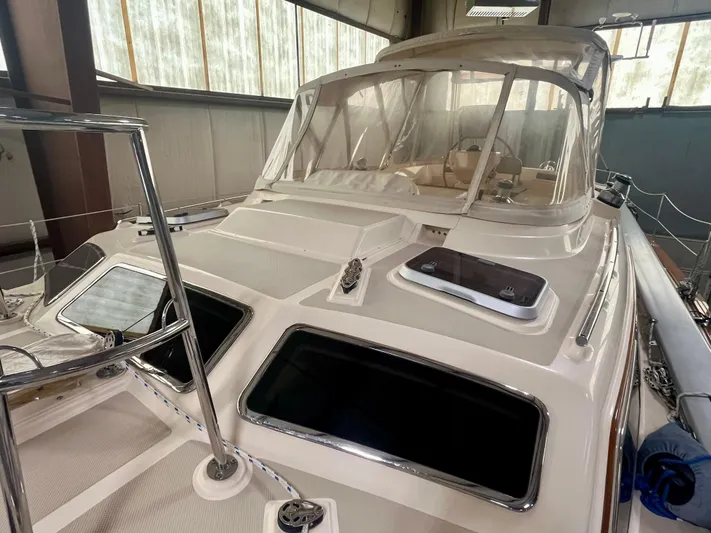 Intrepid II Yacht Photos Pics 2008 Island Packet 465 sailboat in a storage facility, showcasing deck and cockpit area.