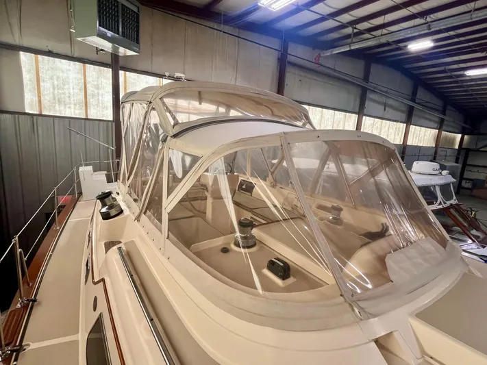Intrepid II Yacht Photos Pics 2008 Island Packet 465 sailboat in indoor storage, featuring a clear cockpit enclosure.