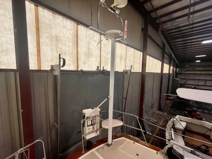 Intrepid II Yacht Photos Pics 2008 Island Packet 465 sailboat in a warehouse, featuring radar and communication equipment.