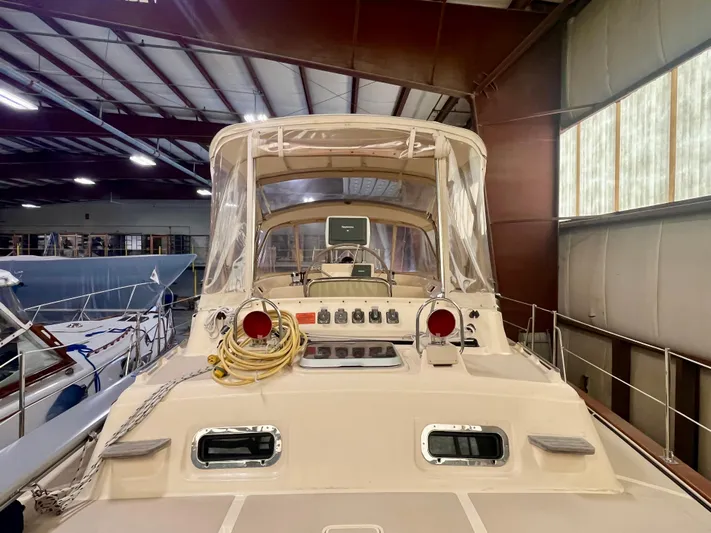 Intrepid II Yacht Photos Pics 2008 Island Packet 465 sailboat in indoor storage, showcasing cockpit and navigation equipment.