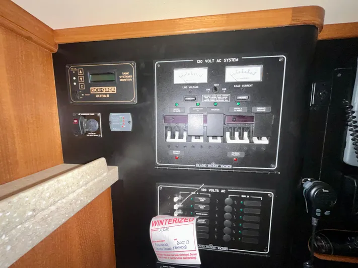 Intrepid II Yacht Photos Pics Electrical control panel on a 2008 Island Packet 465 yacht, featuring gauges and switches.