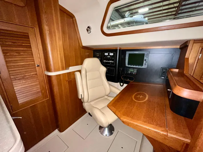 Intrepid II Yacht Photos Pics Luxurious interior of 2008 Island Packet 465 yacht with navigation station and plush seating.