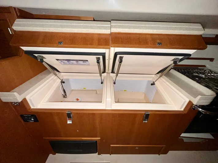 Intrepid II Yacht Photos Pics Interior of 2008 Island Packet 465 yacht showing open storage compartments.